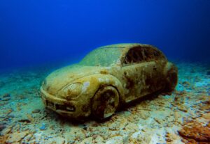 Submerged car sculpture off the coast of Mexico, creating an artificial reef.