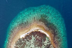 Stunning aerial shot of a coral reef in the clear waters of Indonesia.